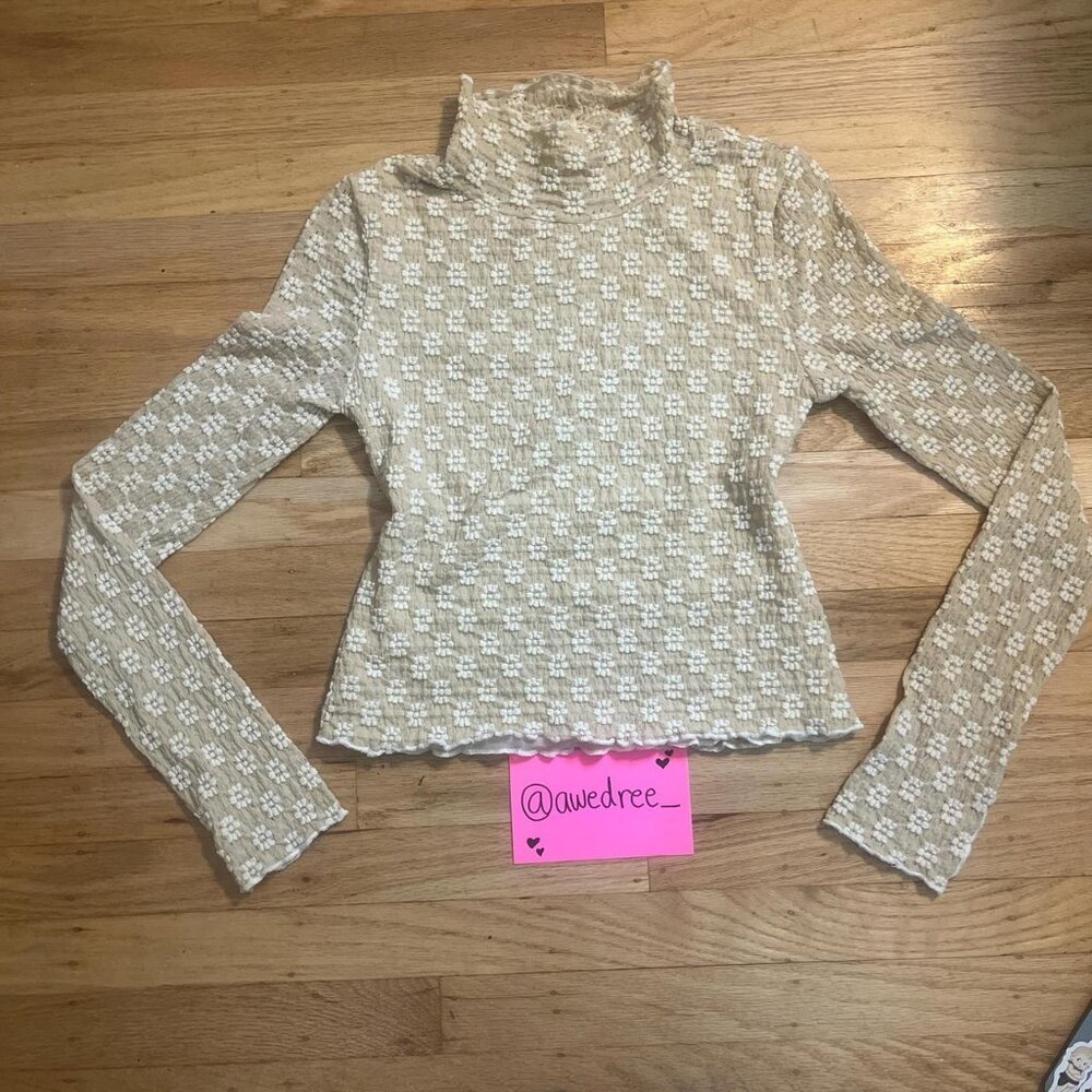 elegant floral turtleneck top